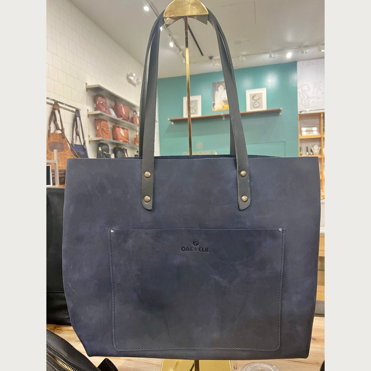 Blue OAK & ELK Classic Leather Tote, a full-grain bag designed to limit leather offcuts