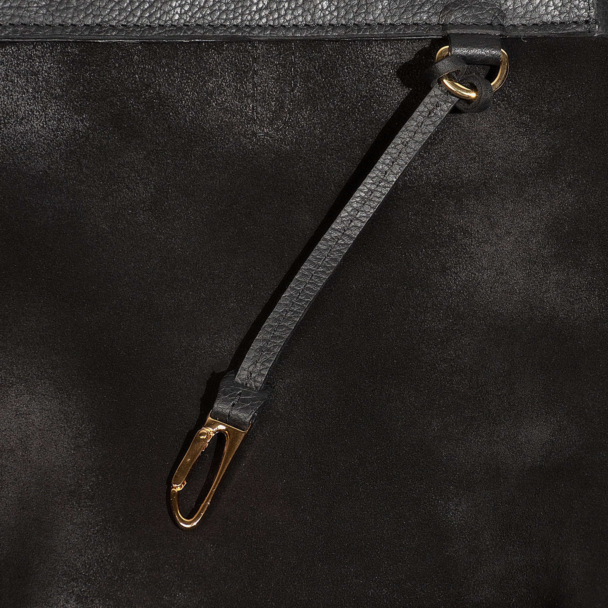 Leather backpack with smooth finish, adjustable straps, front zipper pocket, and gold hardware – Emma by OAK & ELK.