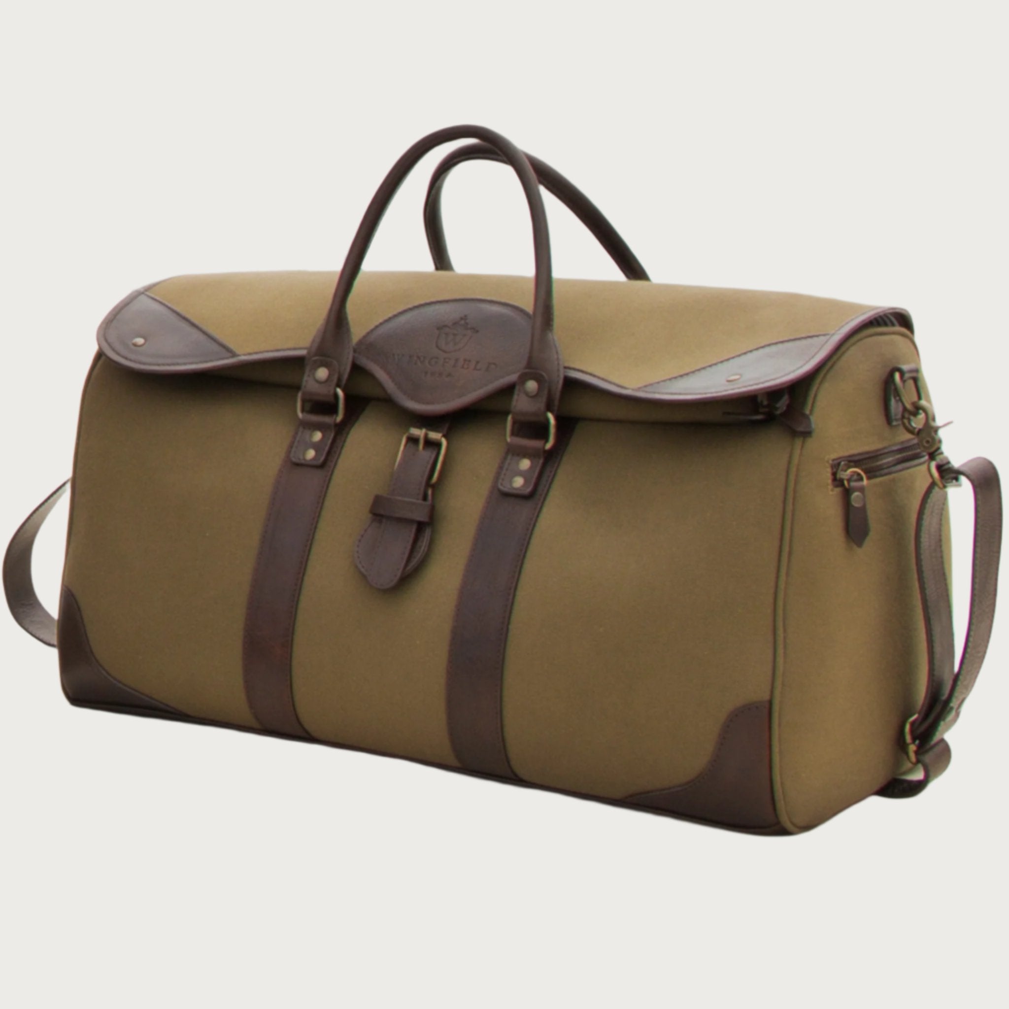 Large canvas and leather duffel bag with top handles, adjustable shoulder strap, leather trim, and zip closure, for travel