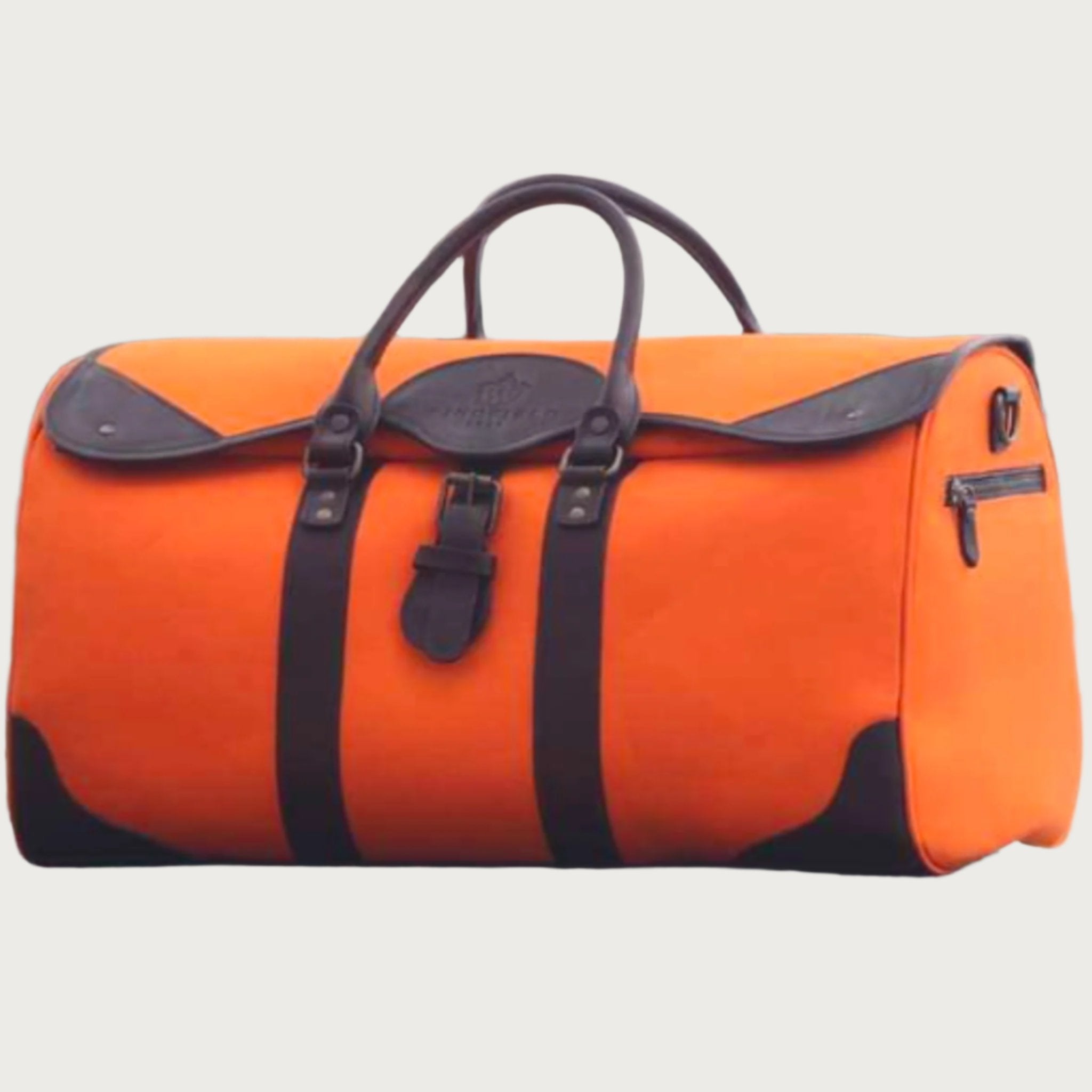 Large canvas and leather duffel bag with top handles, adjustable shoulder strap, leather trim, and zip closure, for travel