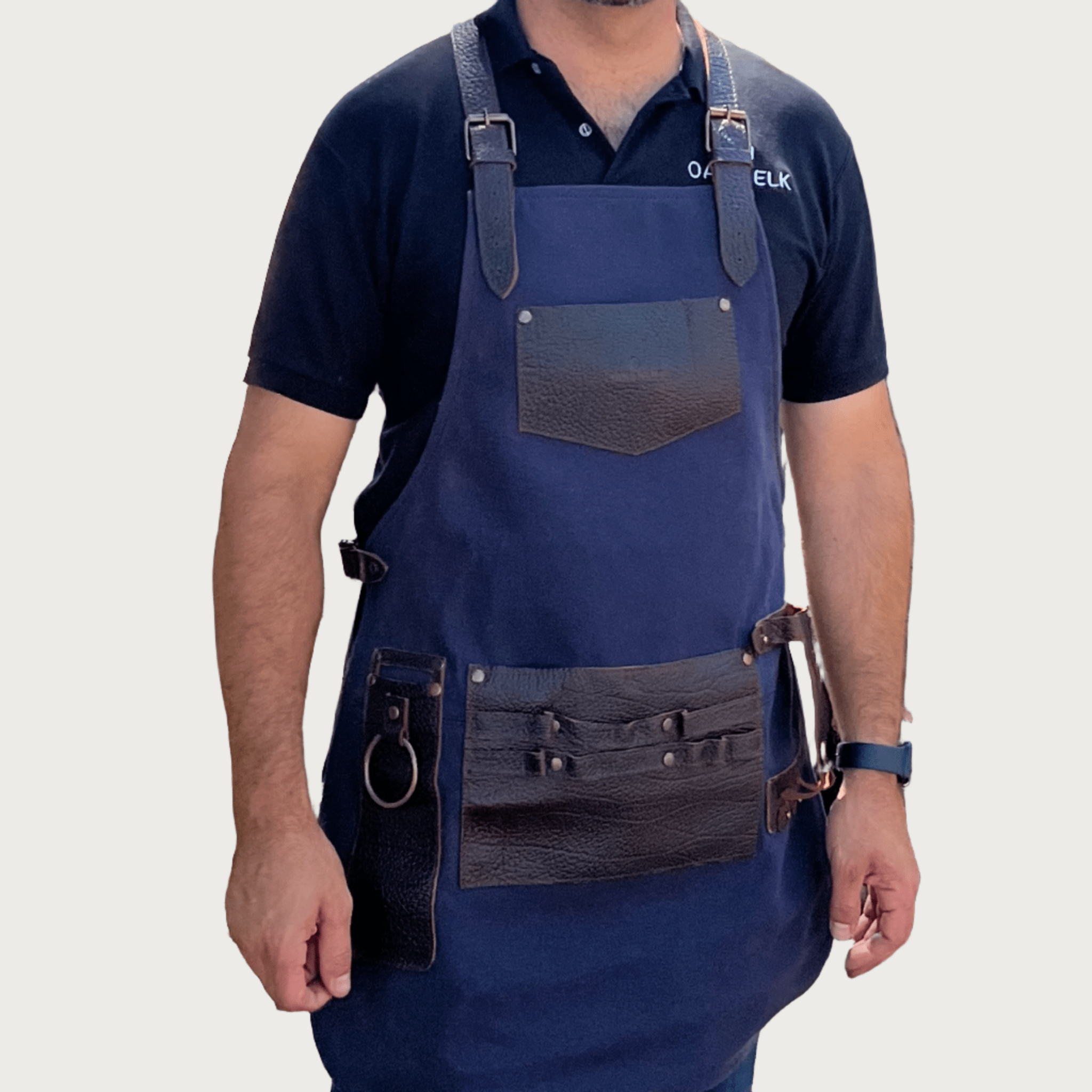 Canvas and leather apron with adjustable straps, chest pocket, and tool loops — durable stylish for grilling, crafts, or work