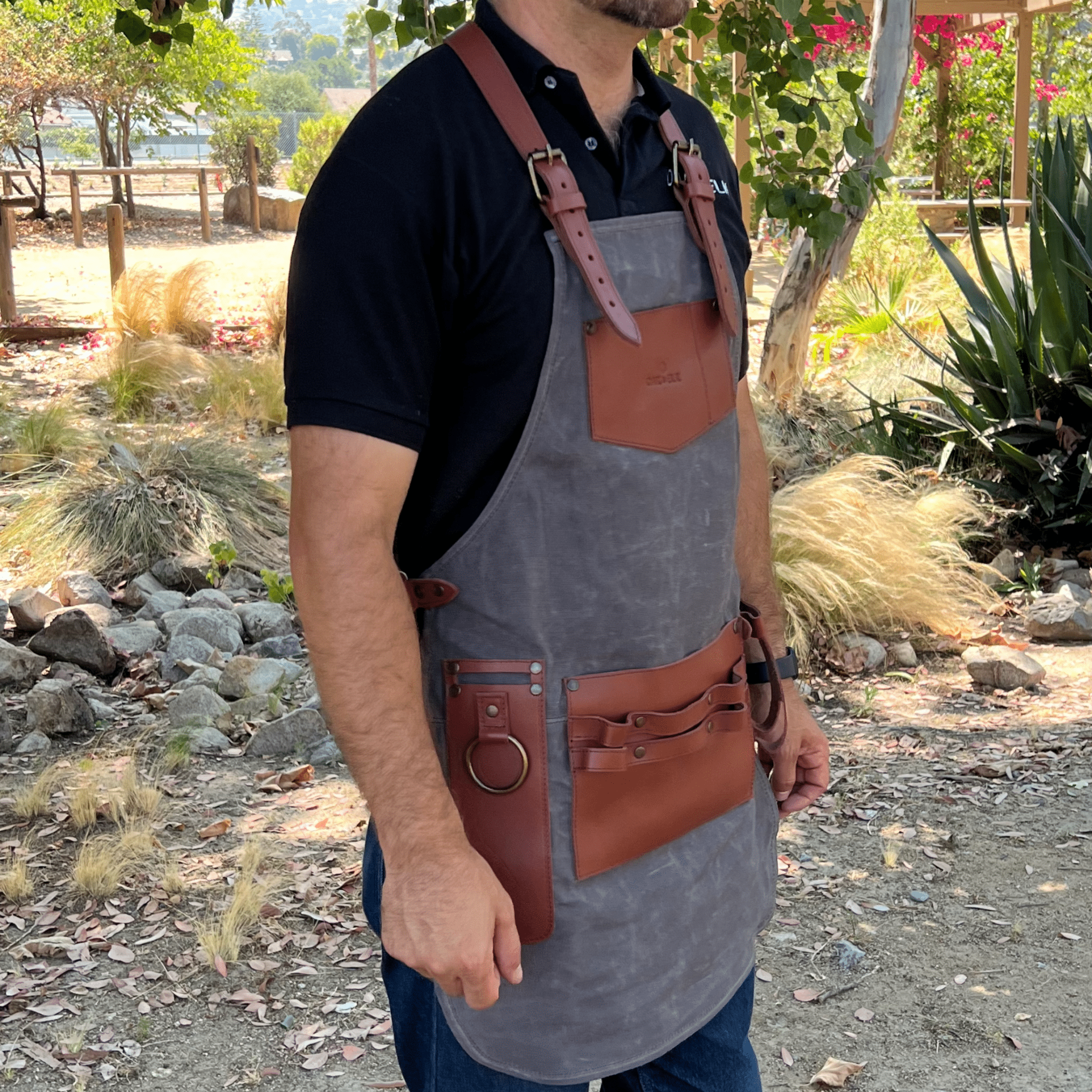 Canvas and leather apron with adjustable straps, chest pocket, and tool loops — durable stylish for grilling, crafts, or work