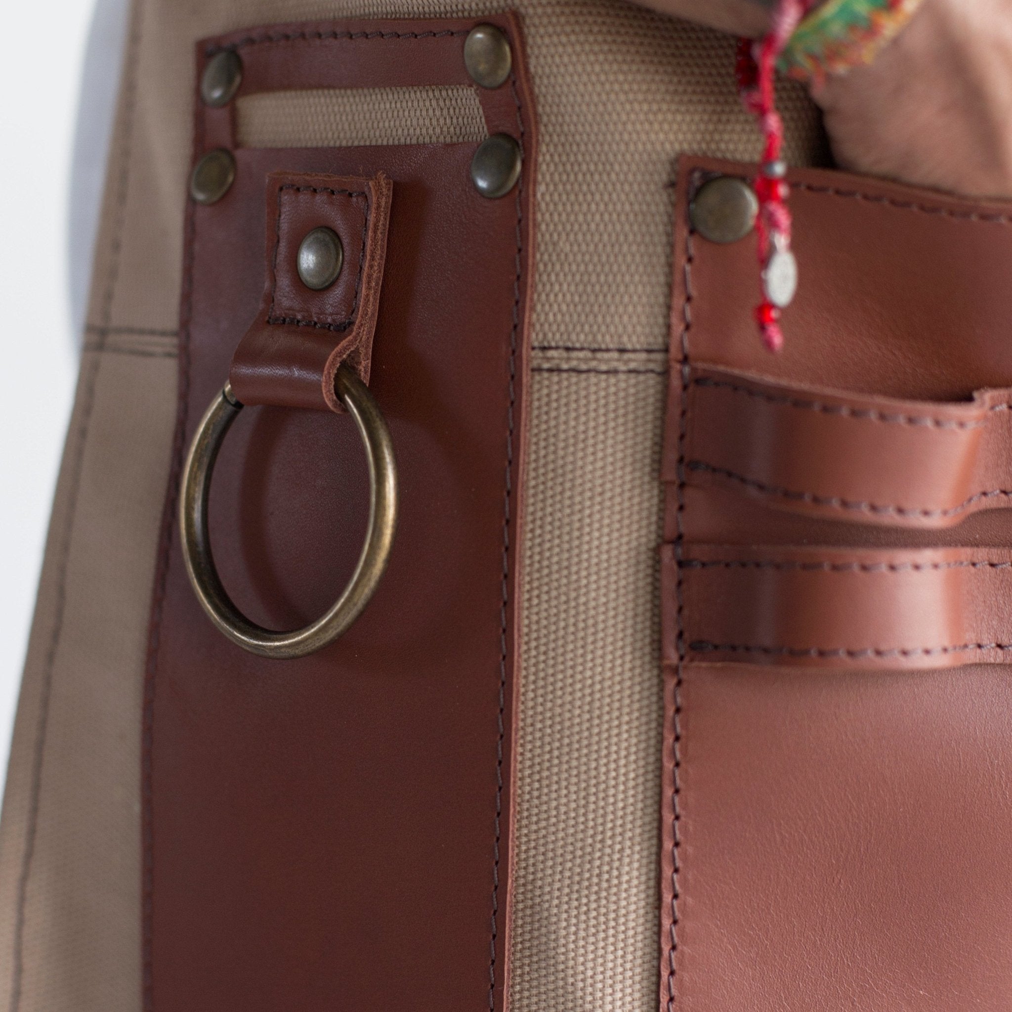 Canvas and leather apron with adjustable straps, chest pocket, and tool loops — durable stylish for grilling, crafts, or work