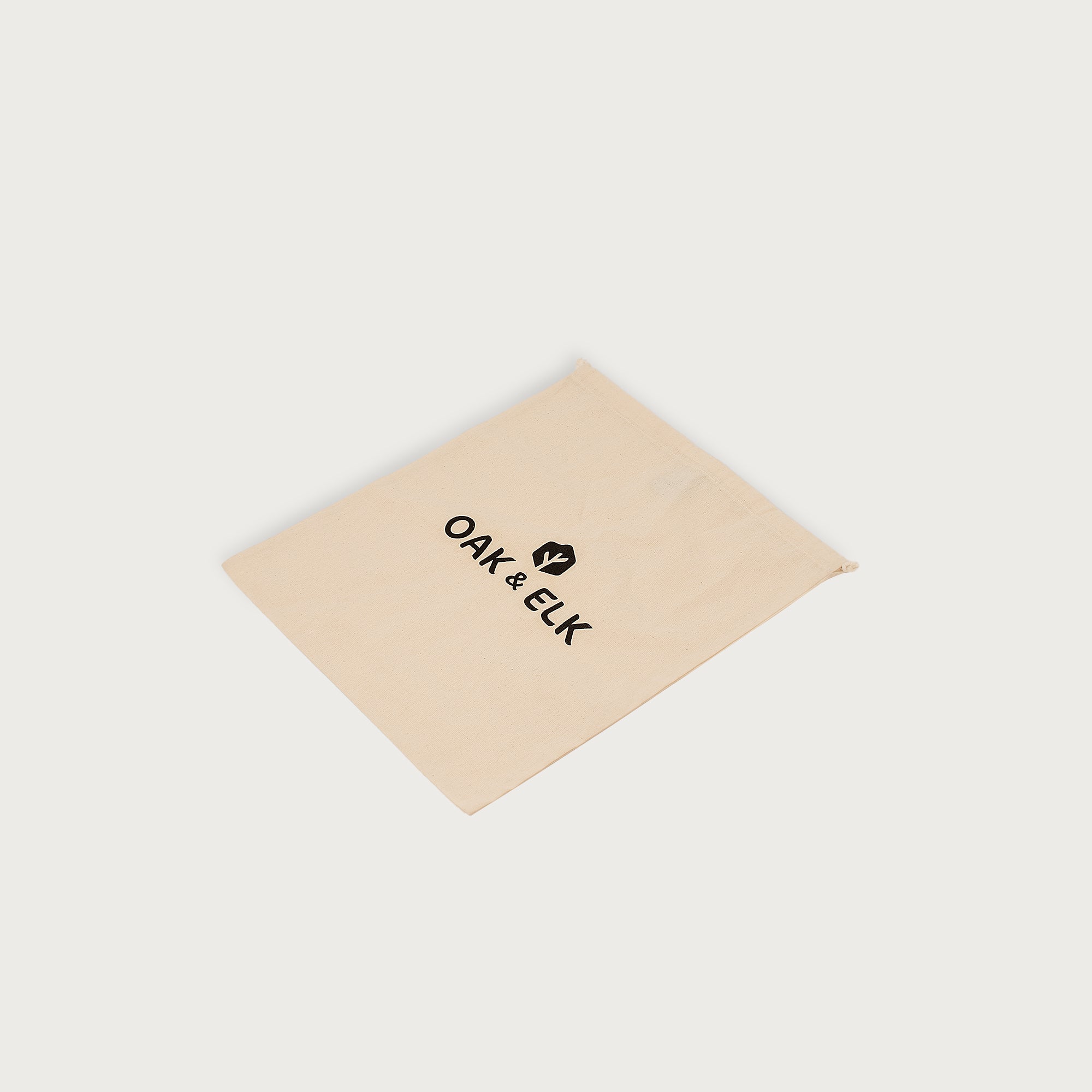 Leather backpack with smooth finish, adjustable straps, front zipper pocket, and gold hardware – Emma by OAK & ELK.