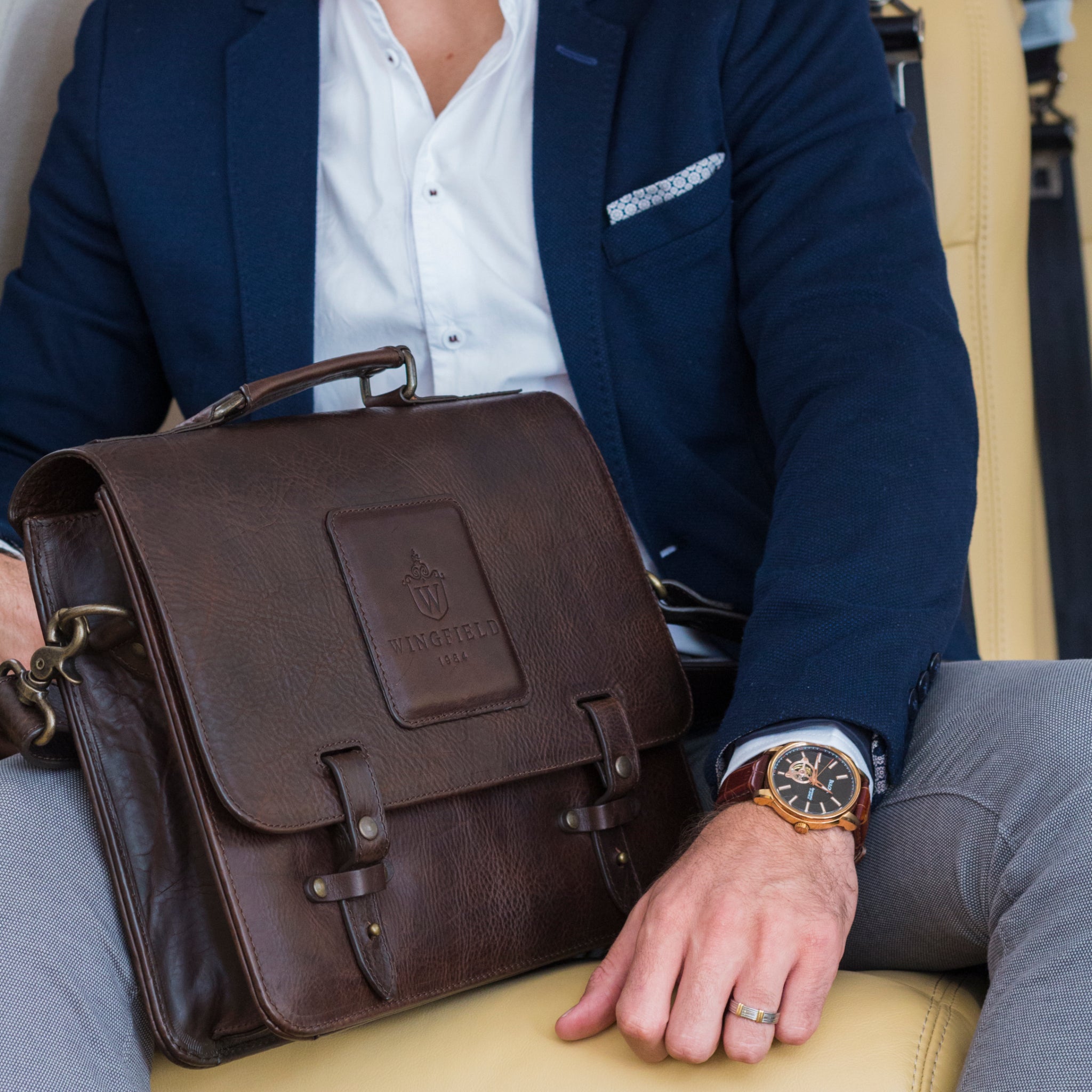 Leather messenger bag with flap closure, buckle details, adjustable strap, and slim profile — ideal for work or travel.