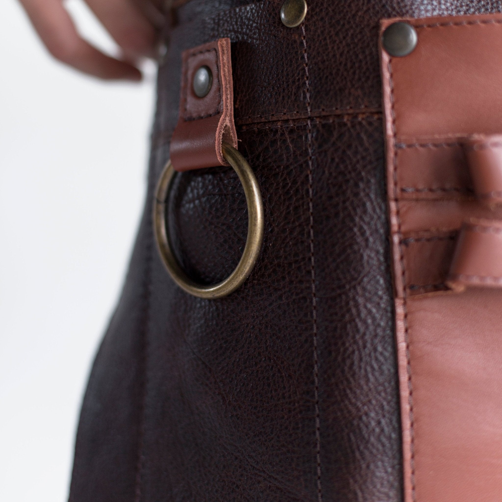 Full leather apron, adjustable straps, front chest pocket, tool loops, and rich texture, ideal for grilling, crafts, shop use