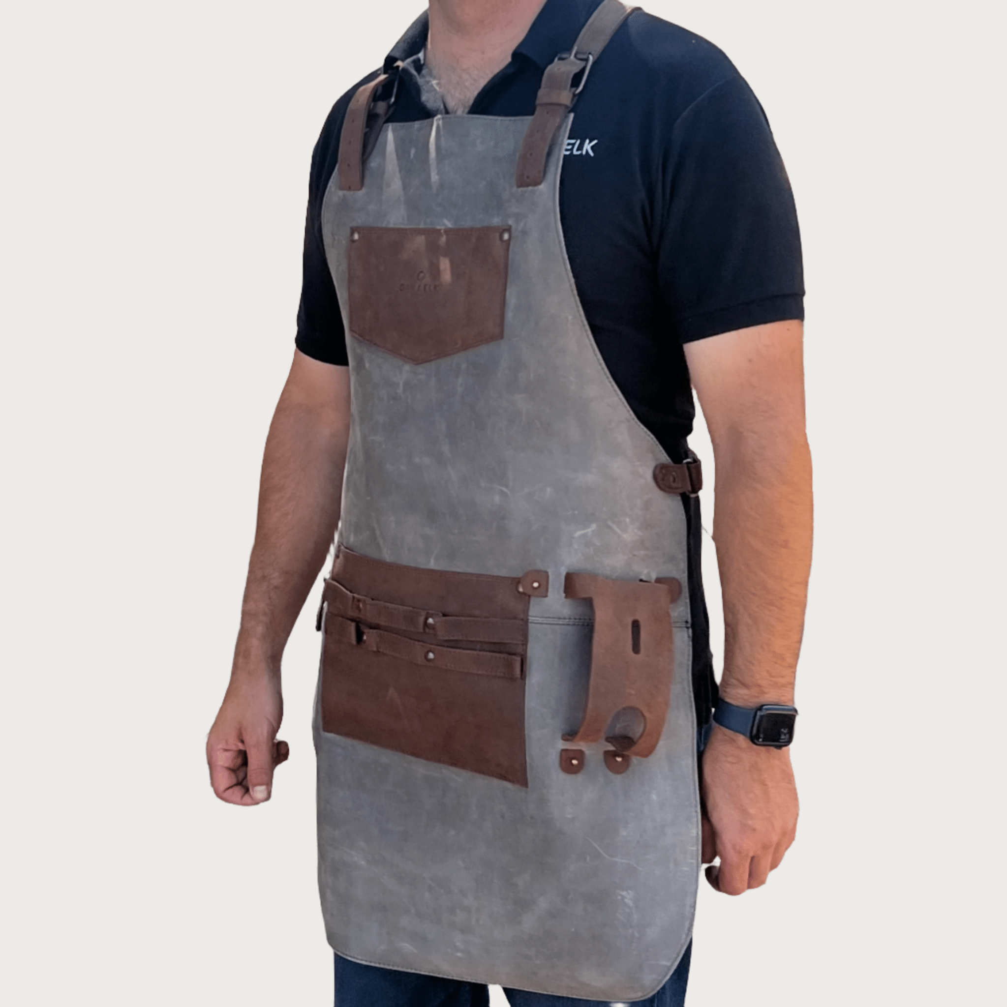 Full leather apron, adjustable straps, front chest pocket, tool loops, and rich texture, ideal for grilling, crafts, shop use
