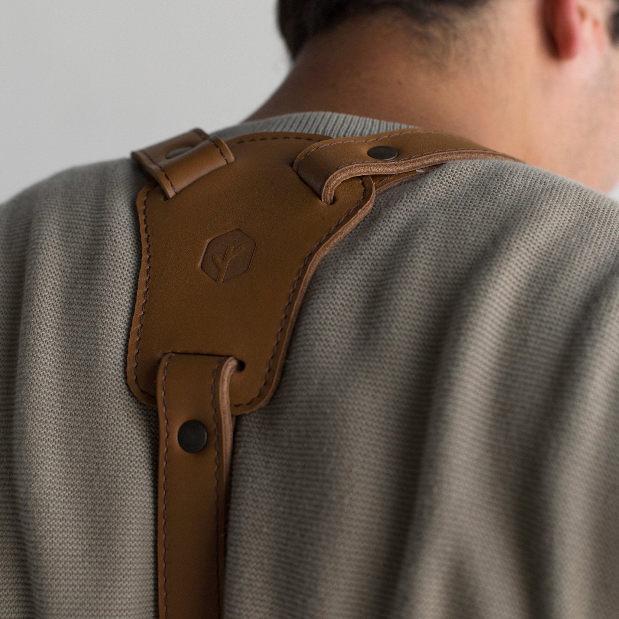 Full leather apron, adjustable straps, front chest pocket, tool loops, and rich texture, ideal for grilling, crafts, shop use