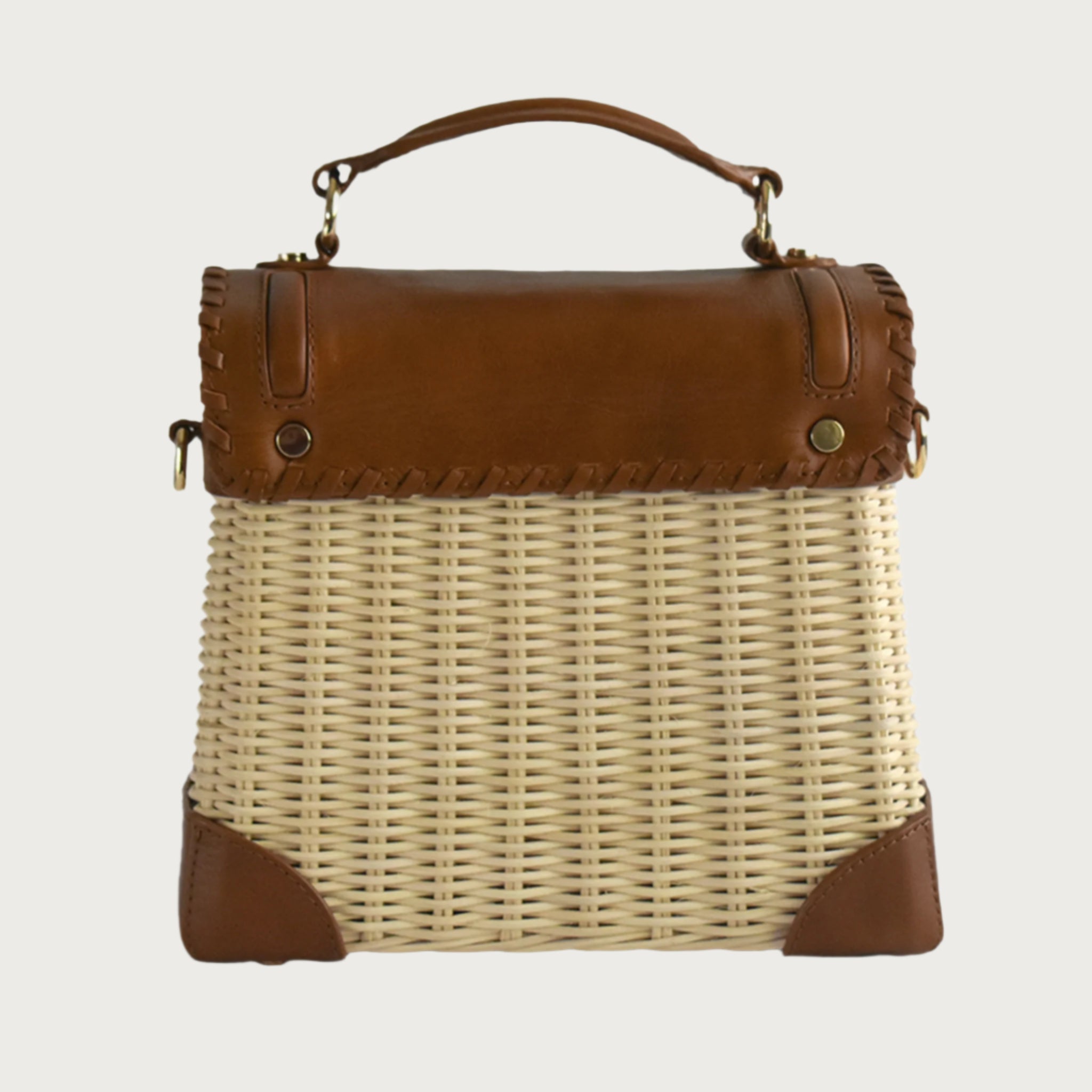Wicker and top-grain leather handbag with structured silhouette, flap closure, and adjustable strap — elegant and lightweight