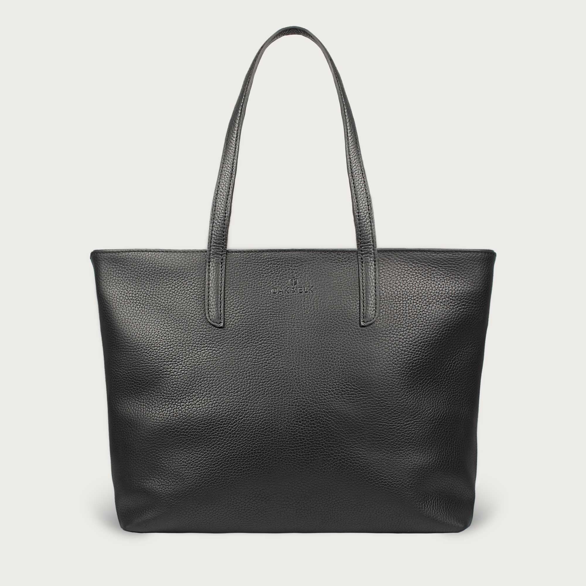 Leather tote made from top-grain leather, featuring smooth golden zipper, inner pouch, and structured design for daily use.