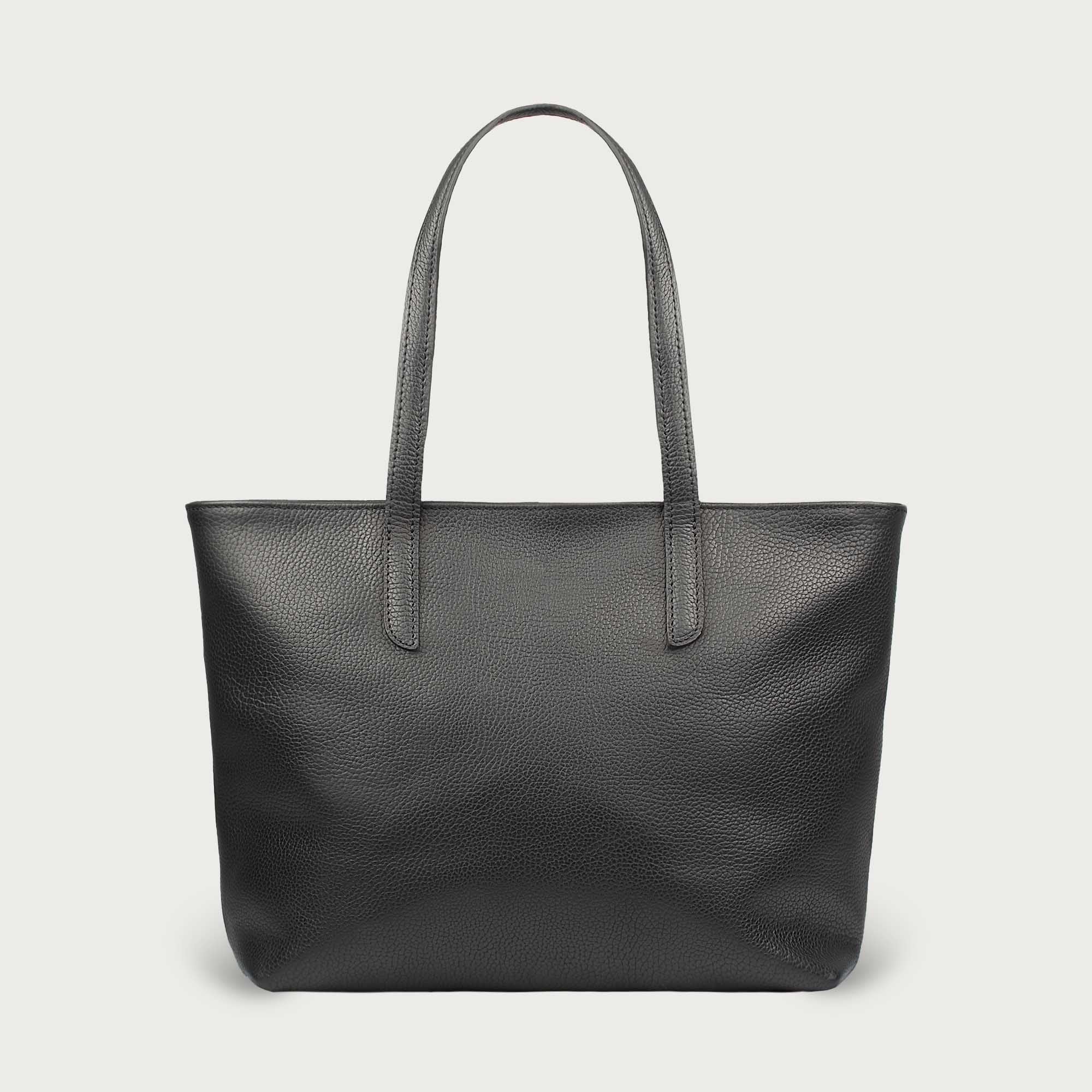 Leather tote made from top-grain leather, featuring smooth golden zipper, inner pouch, and structured design for daily use.