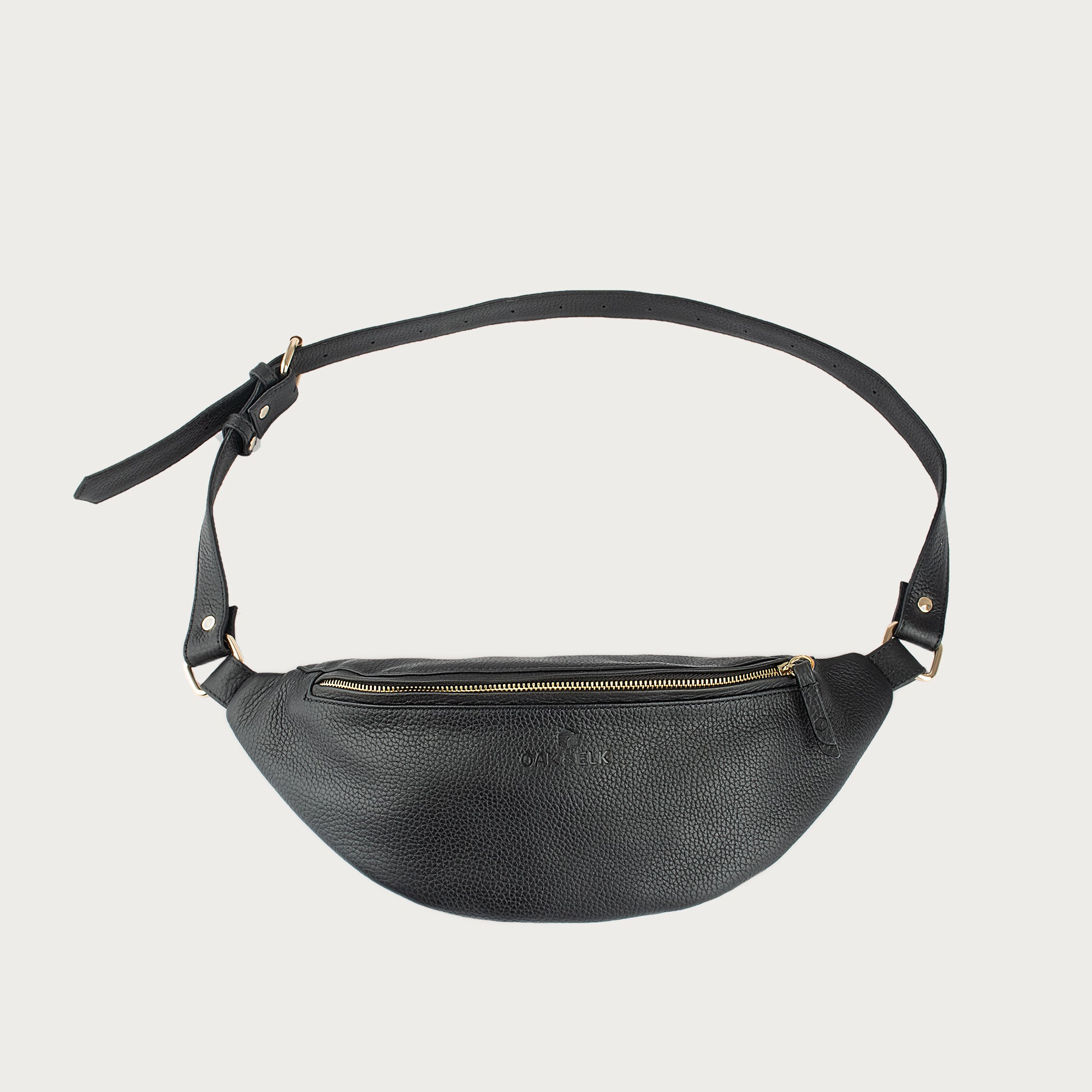 Large black leather fanny pack with multiple compartments, zipper pockets, adjustable strap — sleek practical for daily use