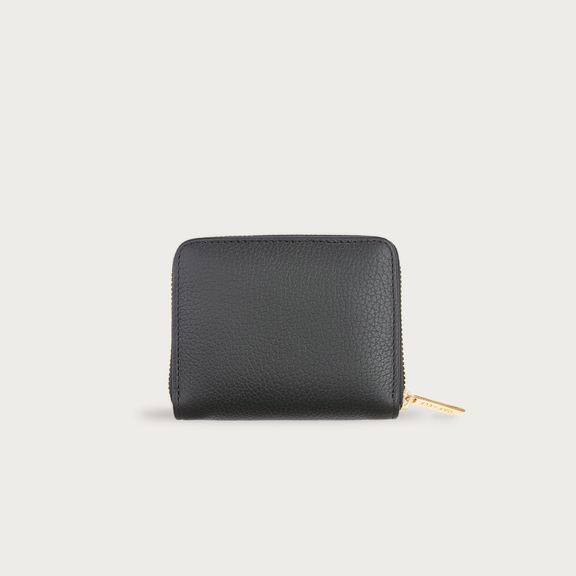 Compact leather wallet with zipper closure and card slots — perfect for essentials and everyday carry.