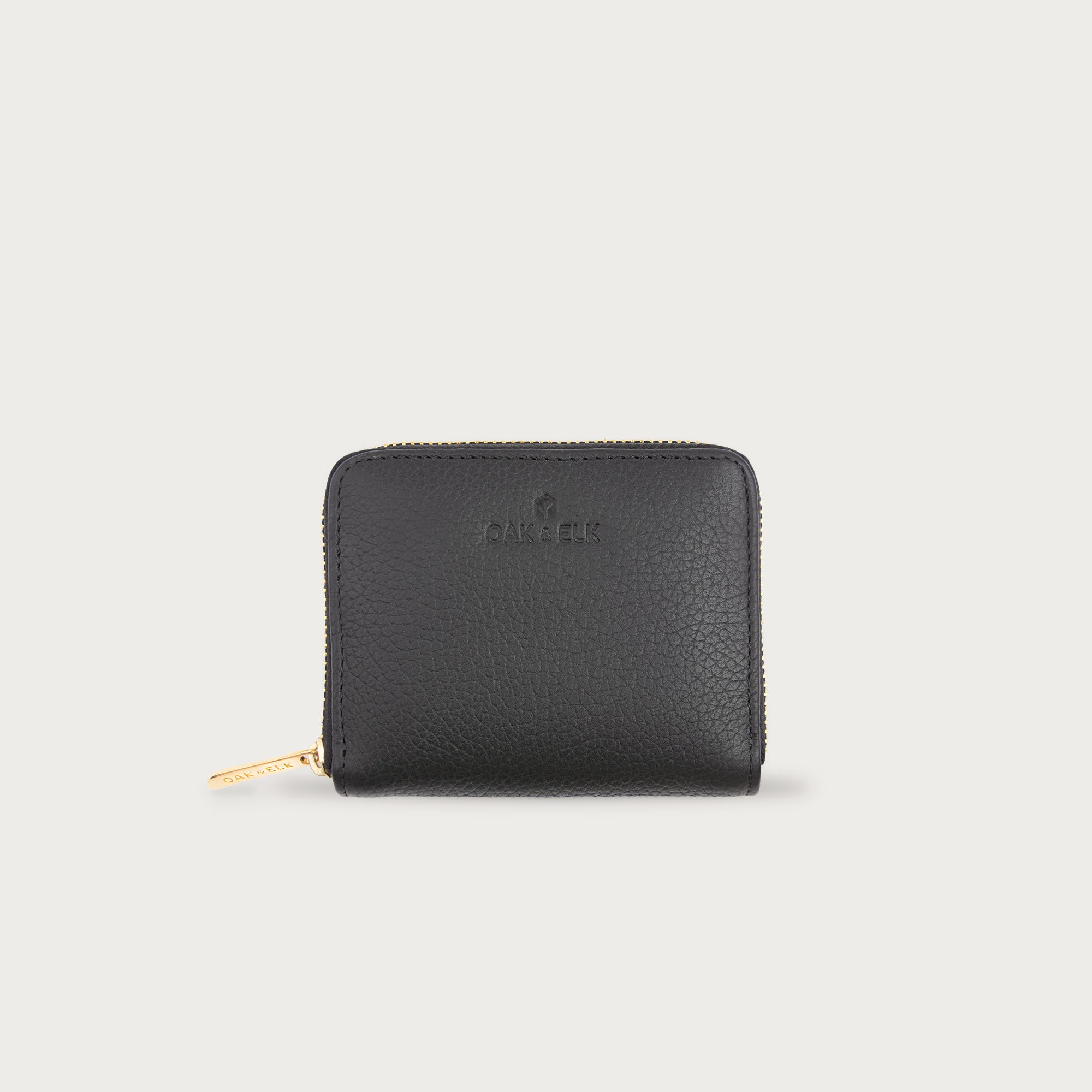 Compact leather wallet with zipper closure and card slots — perfect for essentials and everyday carry.