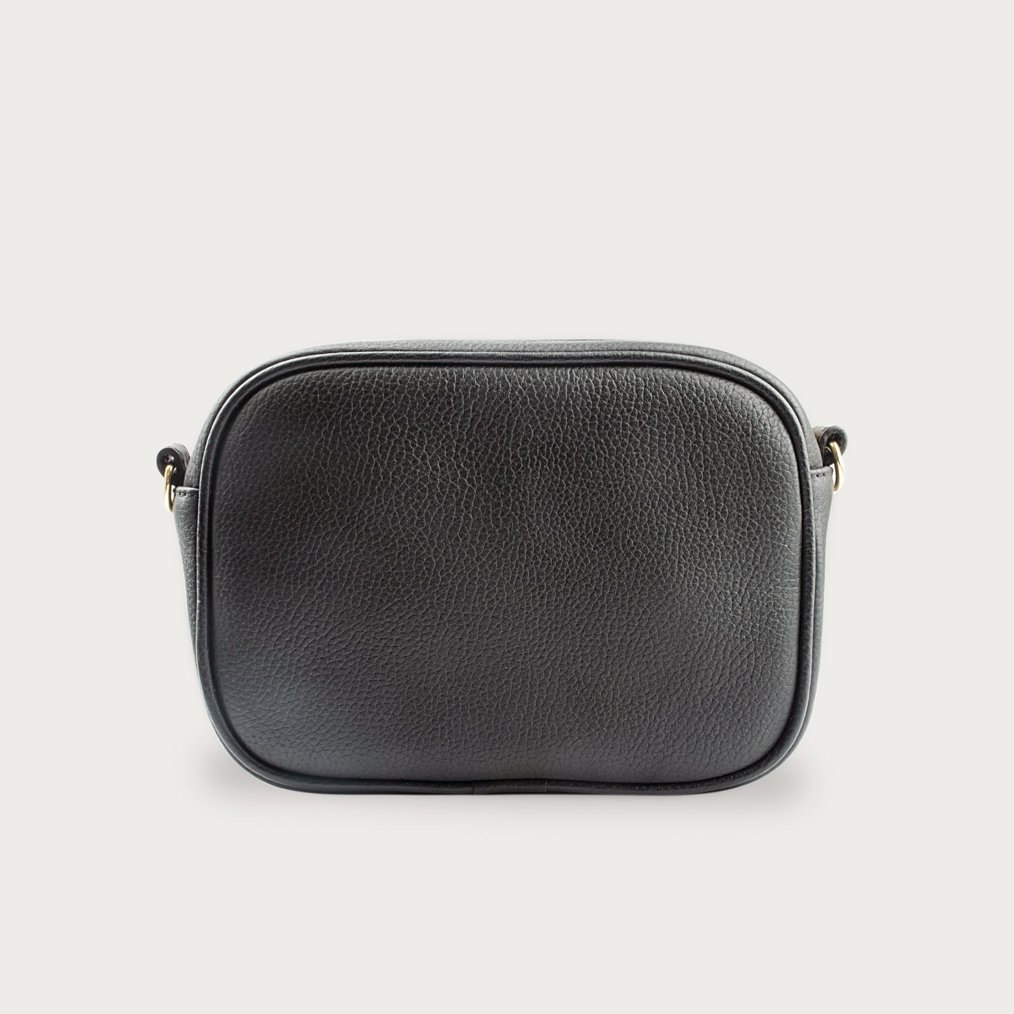 Black leather camera bag with gold zipper, adjustable crossbody strap, and compact design — ideal for essentials on the go.