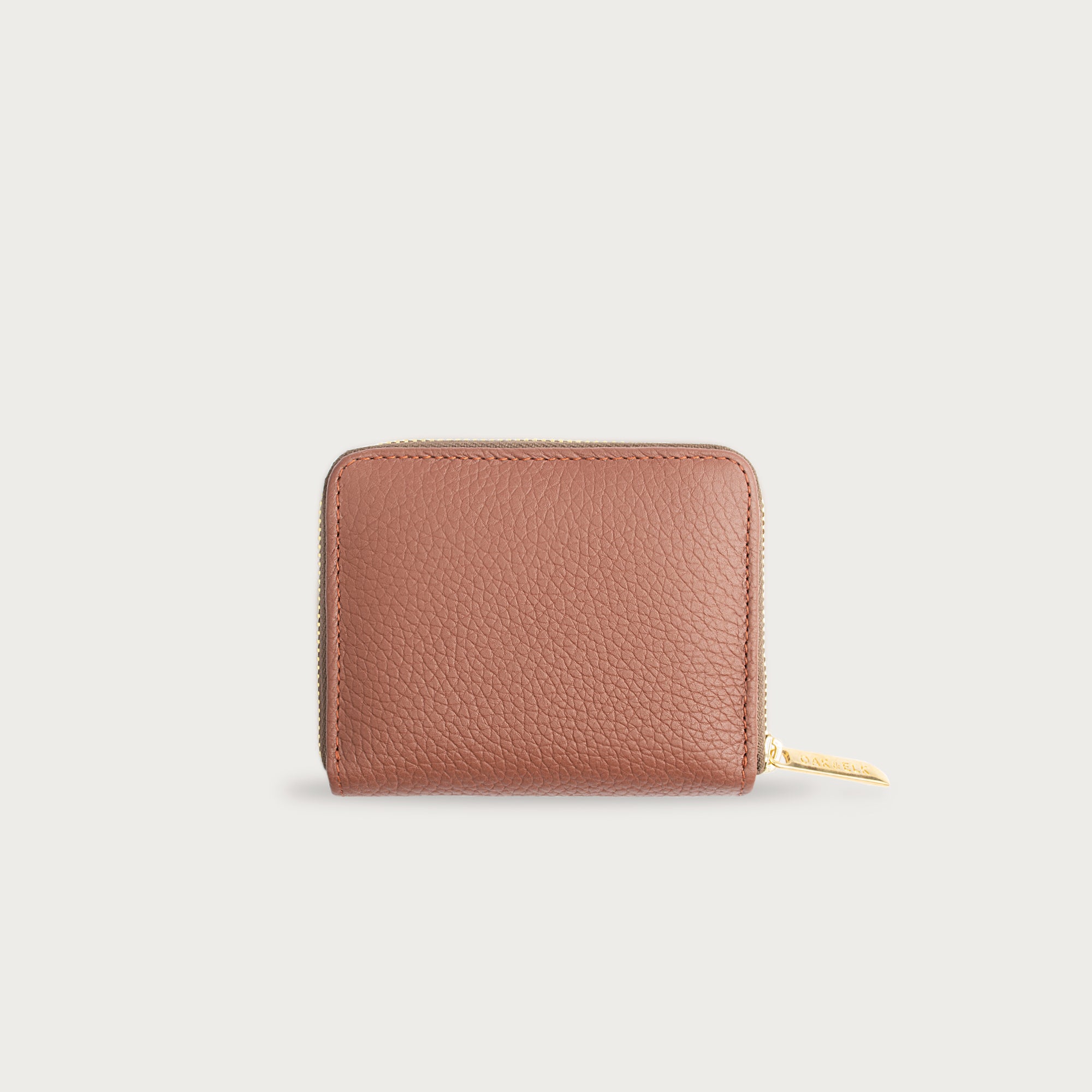 Compact leather wallet with zipper closure and card slots — perfect for essentials and everyday carry.