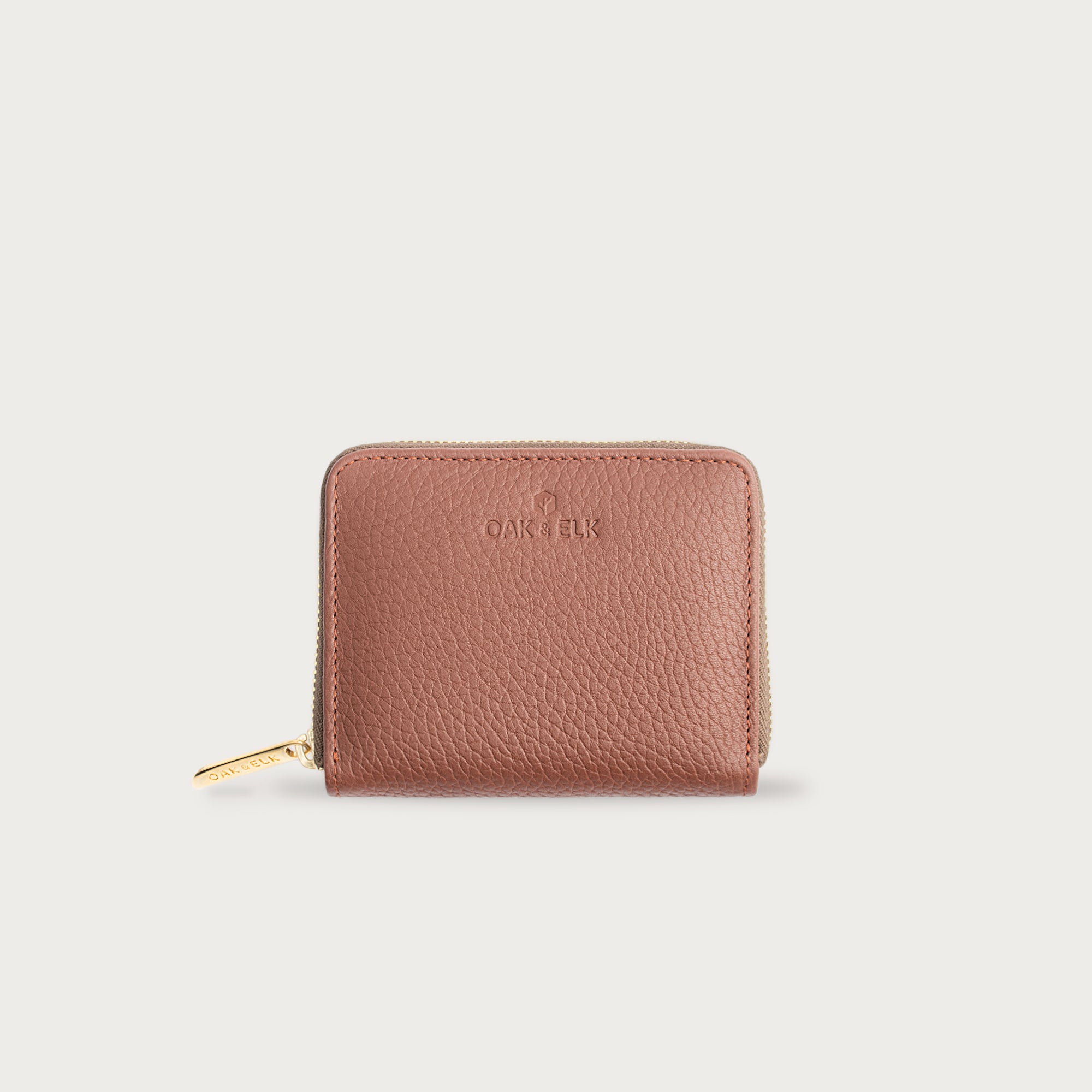 Compact leather wallet with zipper closure and card slots — perfect for essentials and everyday carry.