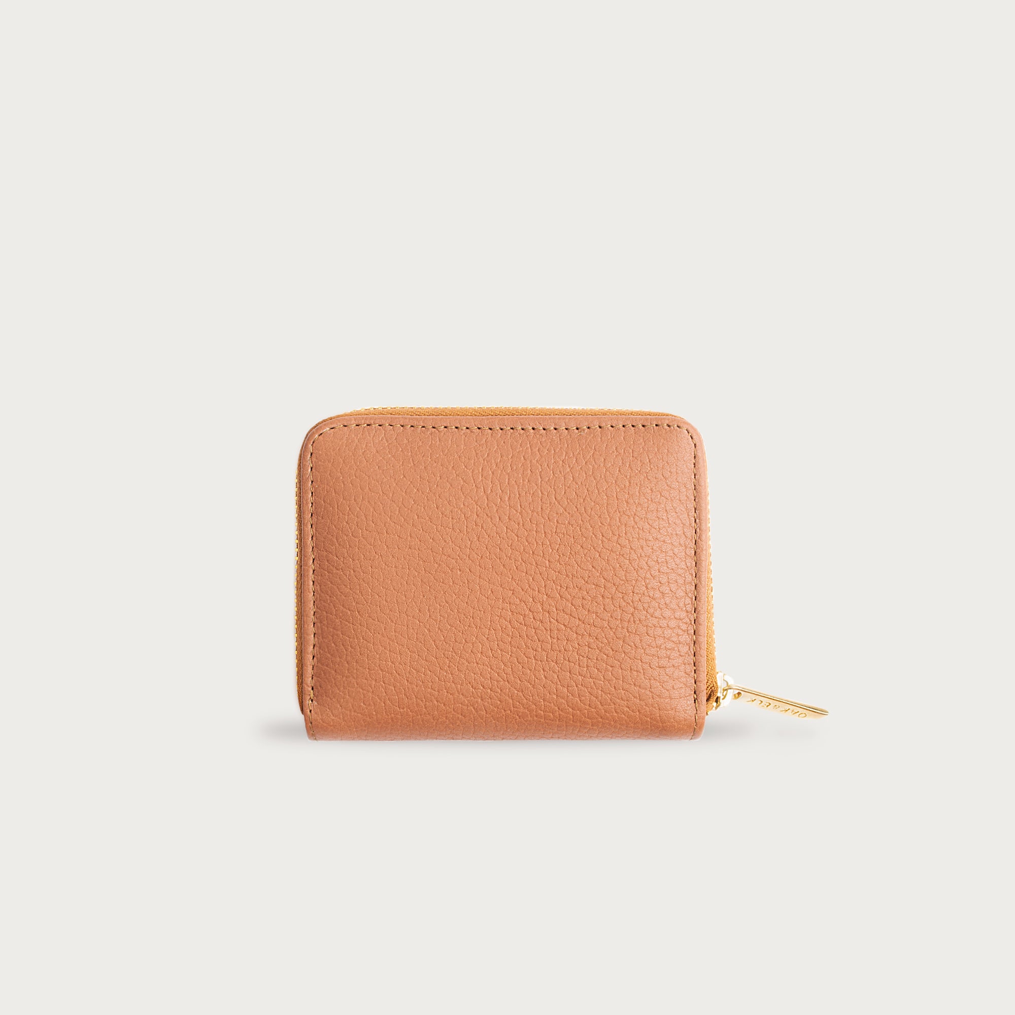 Compact leather wallet with zipper closure and card slots — perfect for essentials and everyday carry.