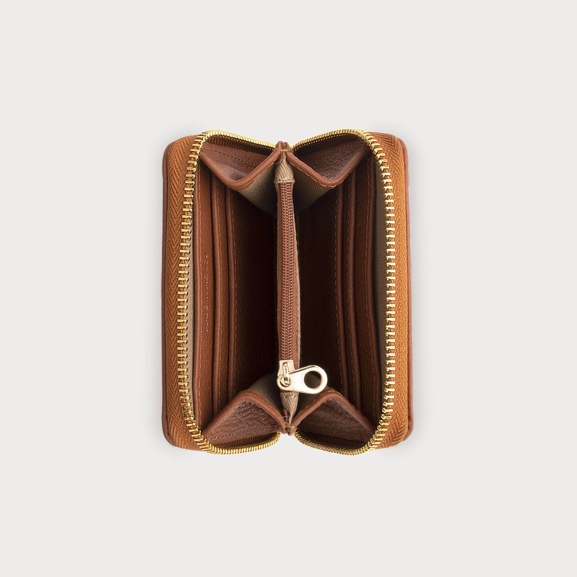 Compact leather wallet with zipper closure and card slots — perfect for essentials and everyday carry.