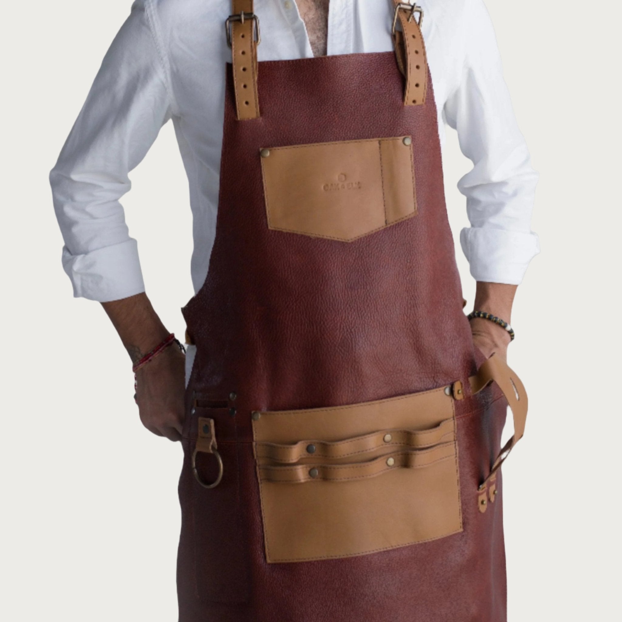 Nutmeg pebbled leather apron for woodworking with tool pockets and adjustable straps by OAK & ELK