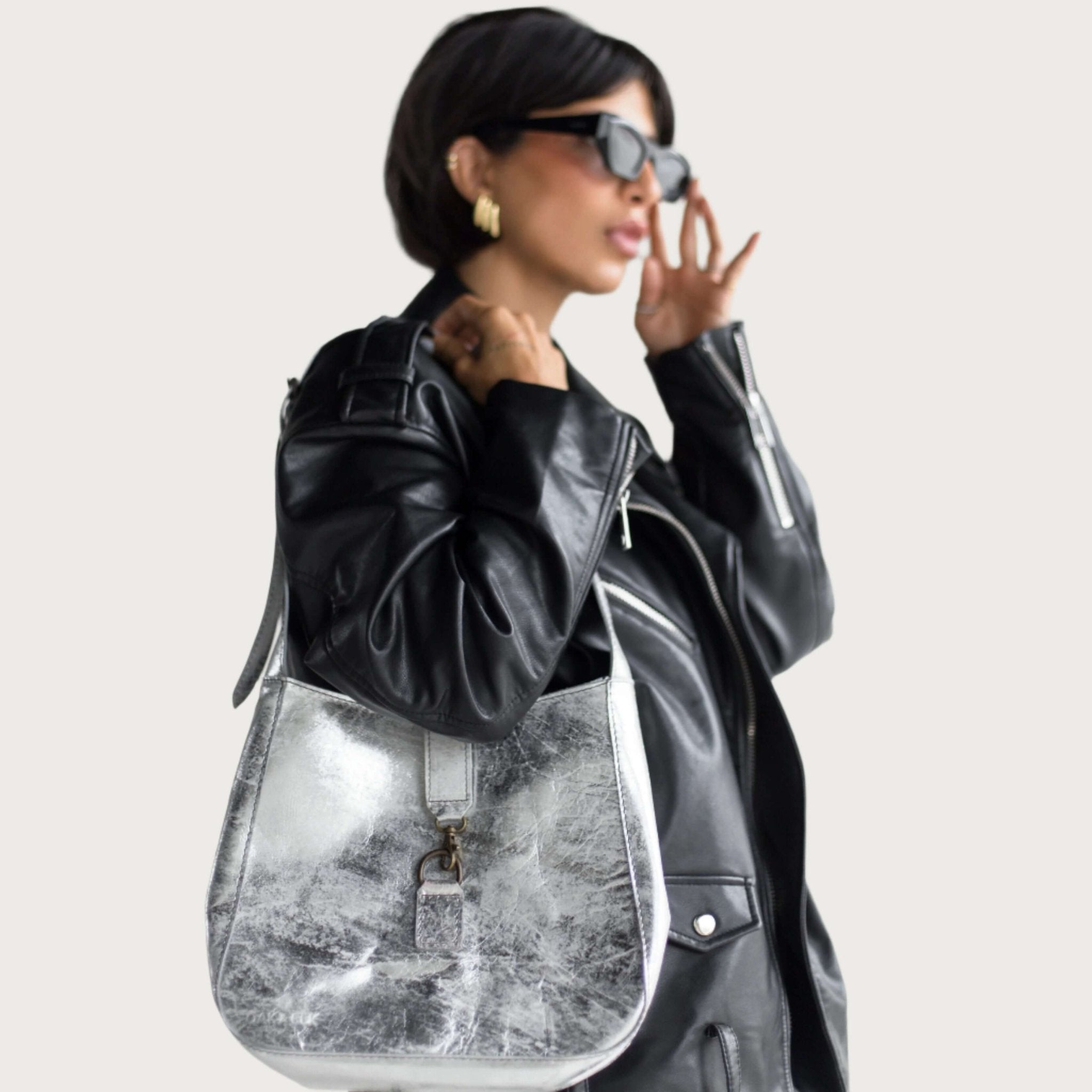 Silver full-grain leather shoulder bag by OAK & ELK, illustrating leather traceability from tannery to finished bag
