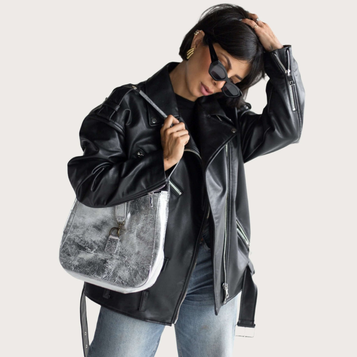 Silver full-grain leather shoulder bag representing LWG certified leather craftsmanship