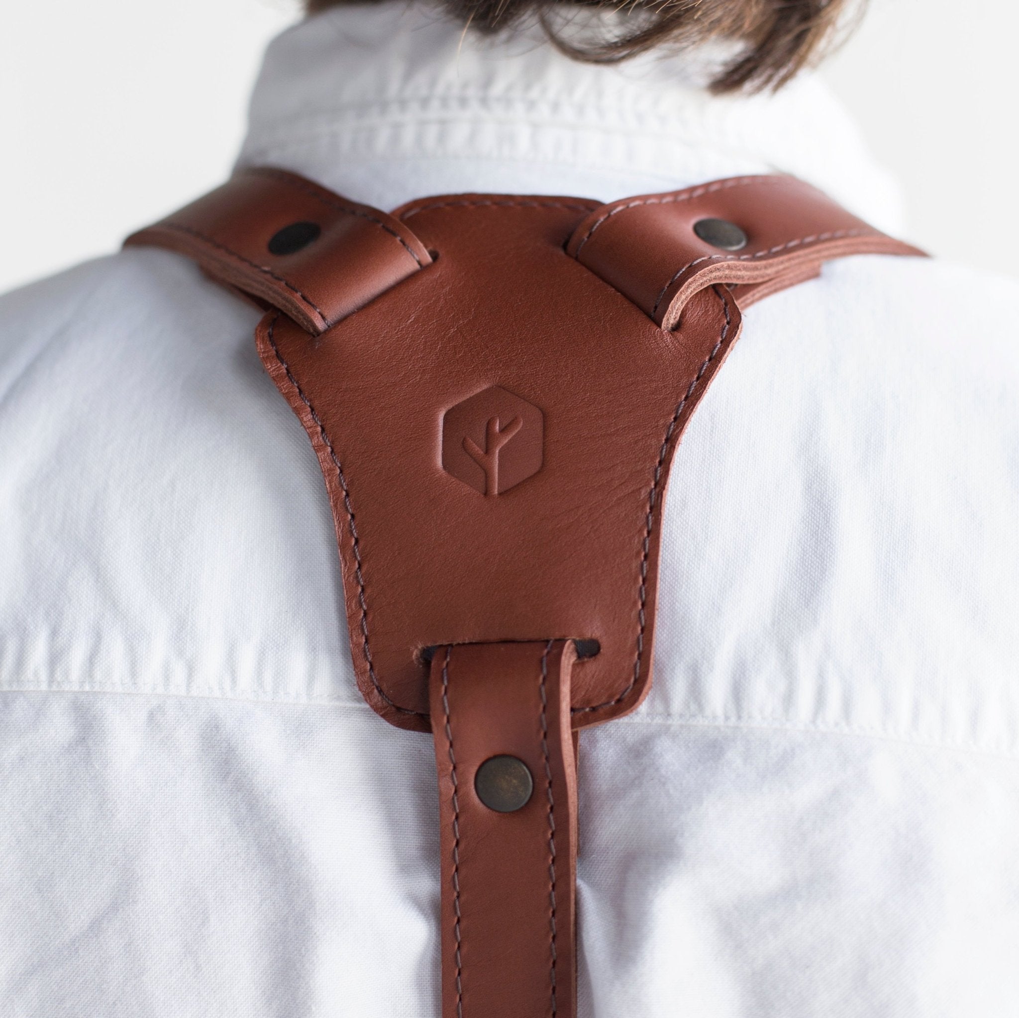 Canvas and leather apron with adjustable straps, chest pocket, and tool loops — durable stylish for grilling, crafts, or work