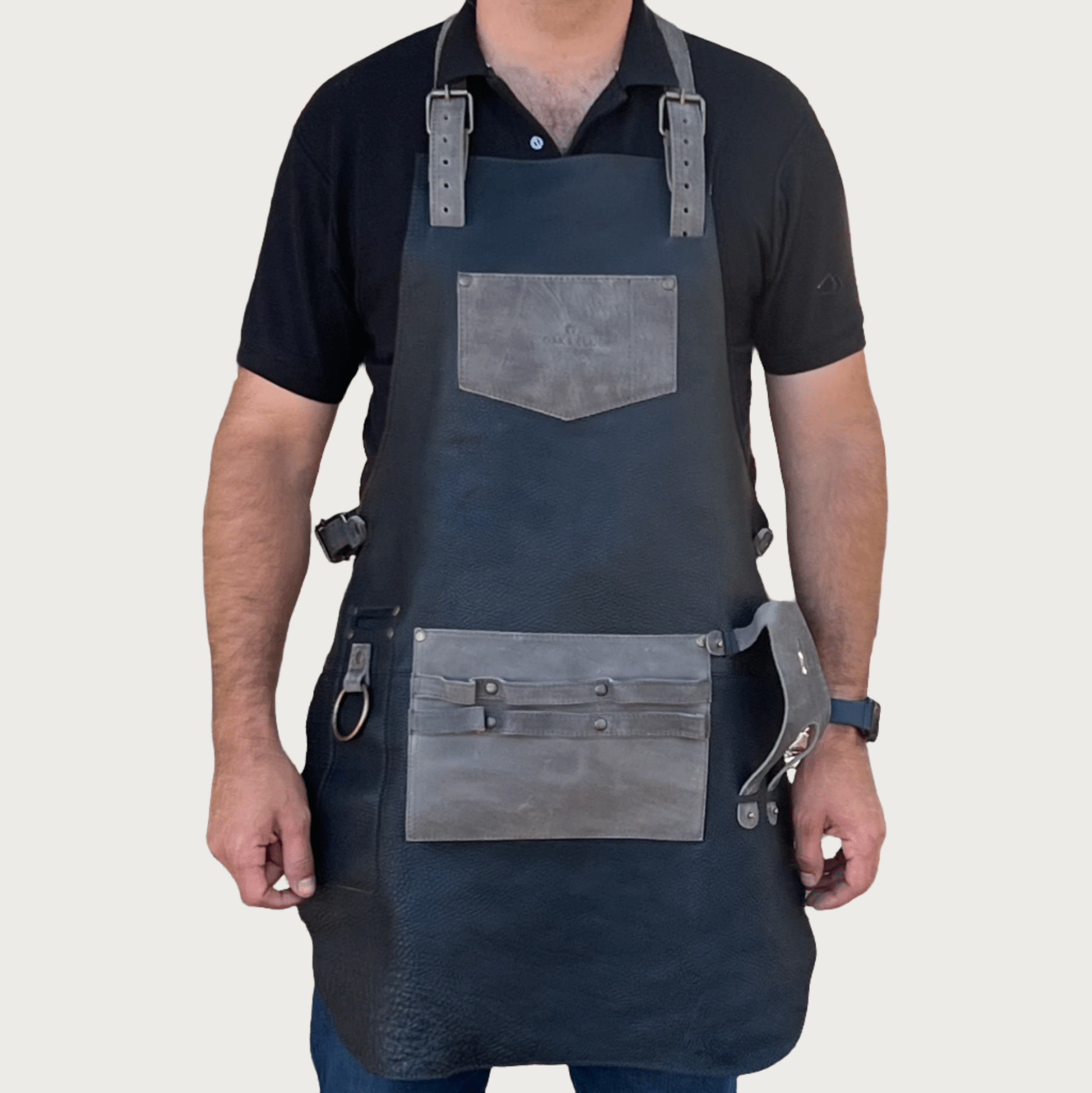 Full leather apron, adjustable straps, front chest pocket, tool loops, and rich texture, ideal for grilling, crafts, shop use