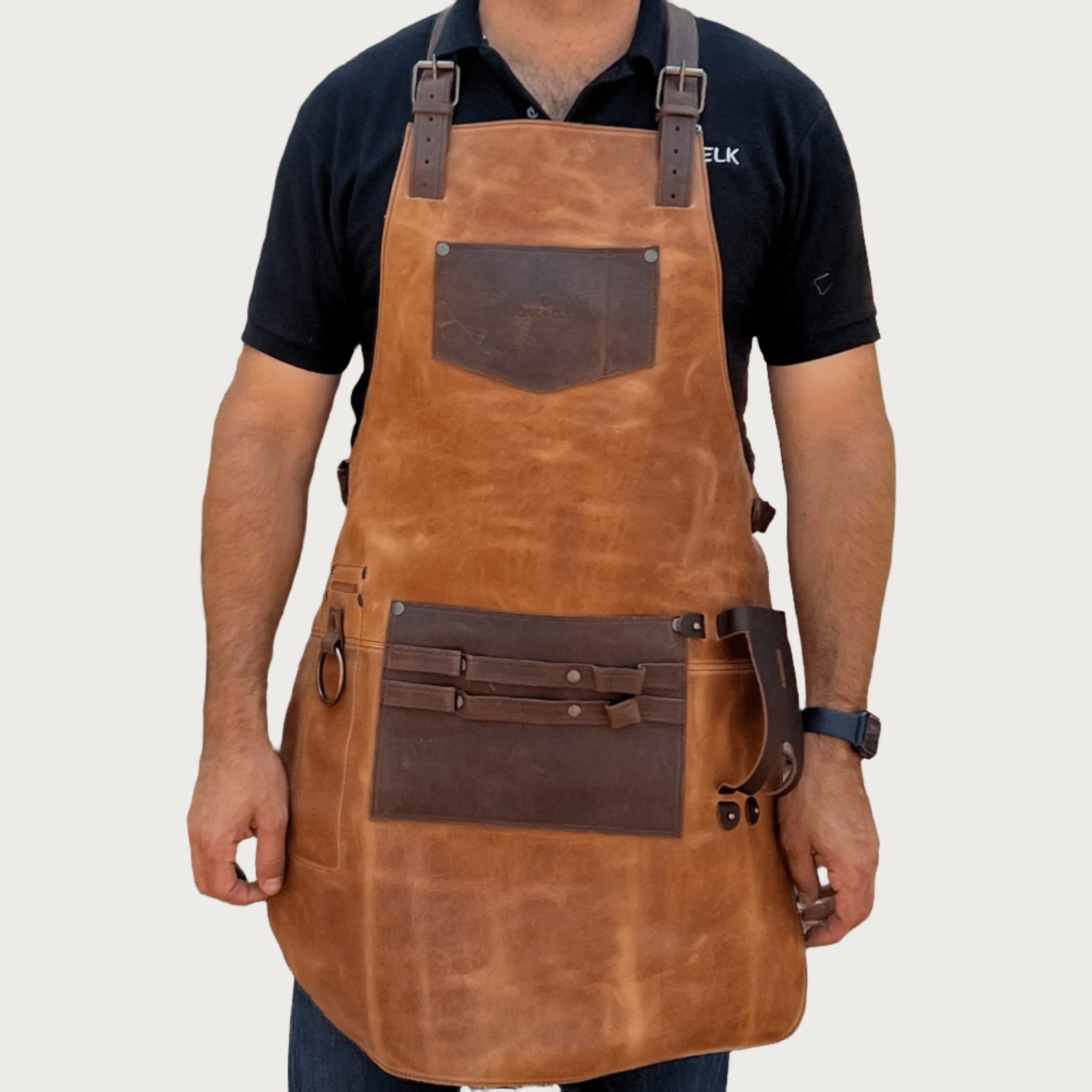 Full leather apron, adjustable straps, front chest pocket, tool loops, and rich texture, ideal for grilling, crafts, shop use