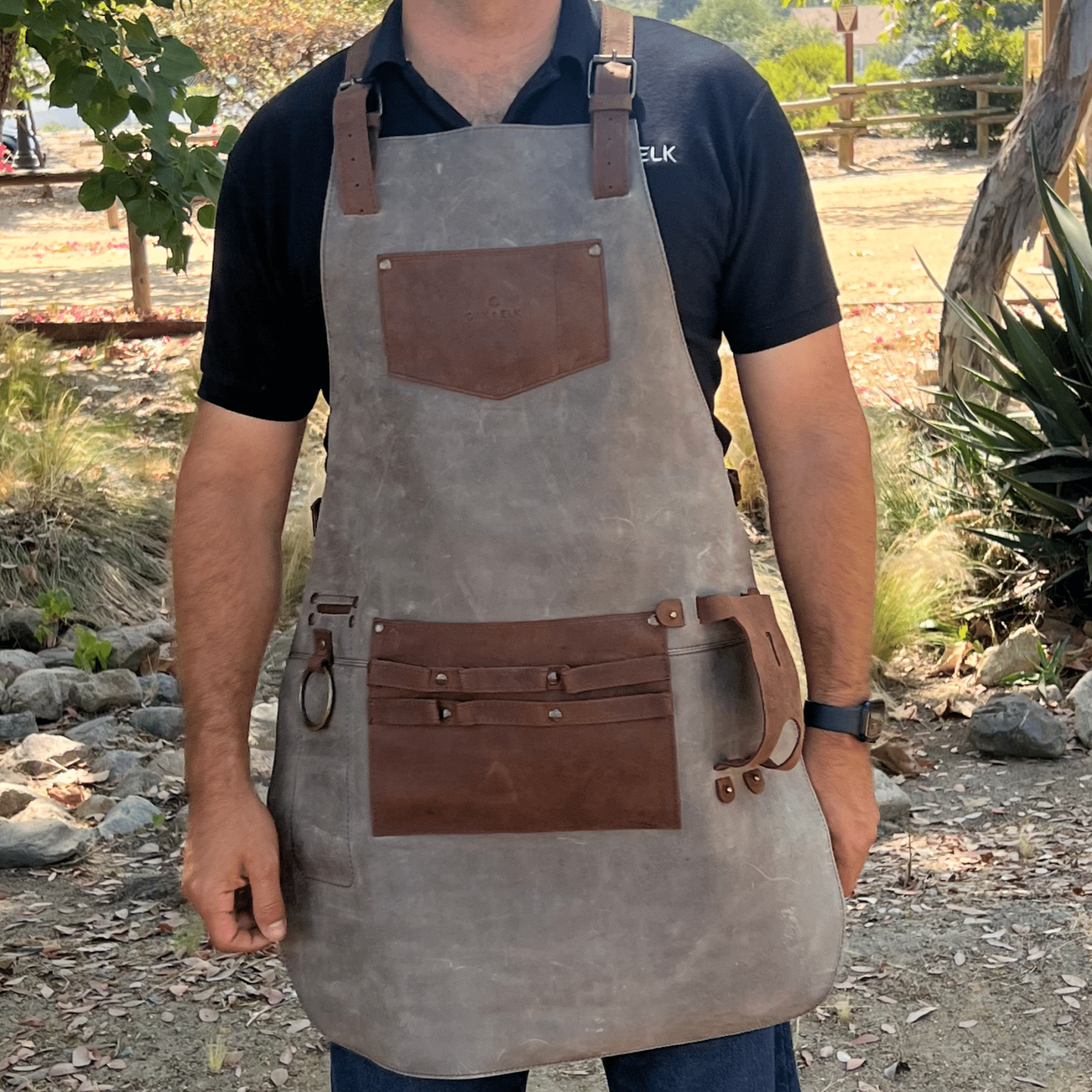 Full leather apron, adjustable straps, front chest pocket, tool loops, and rich texture, ideal for grilling, crafts, shop use