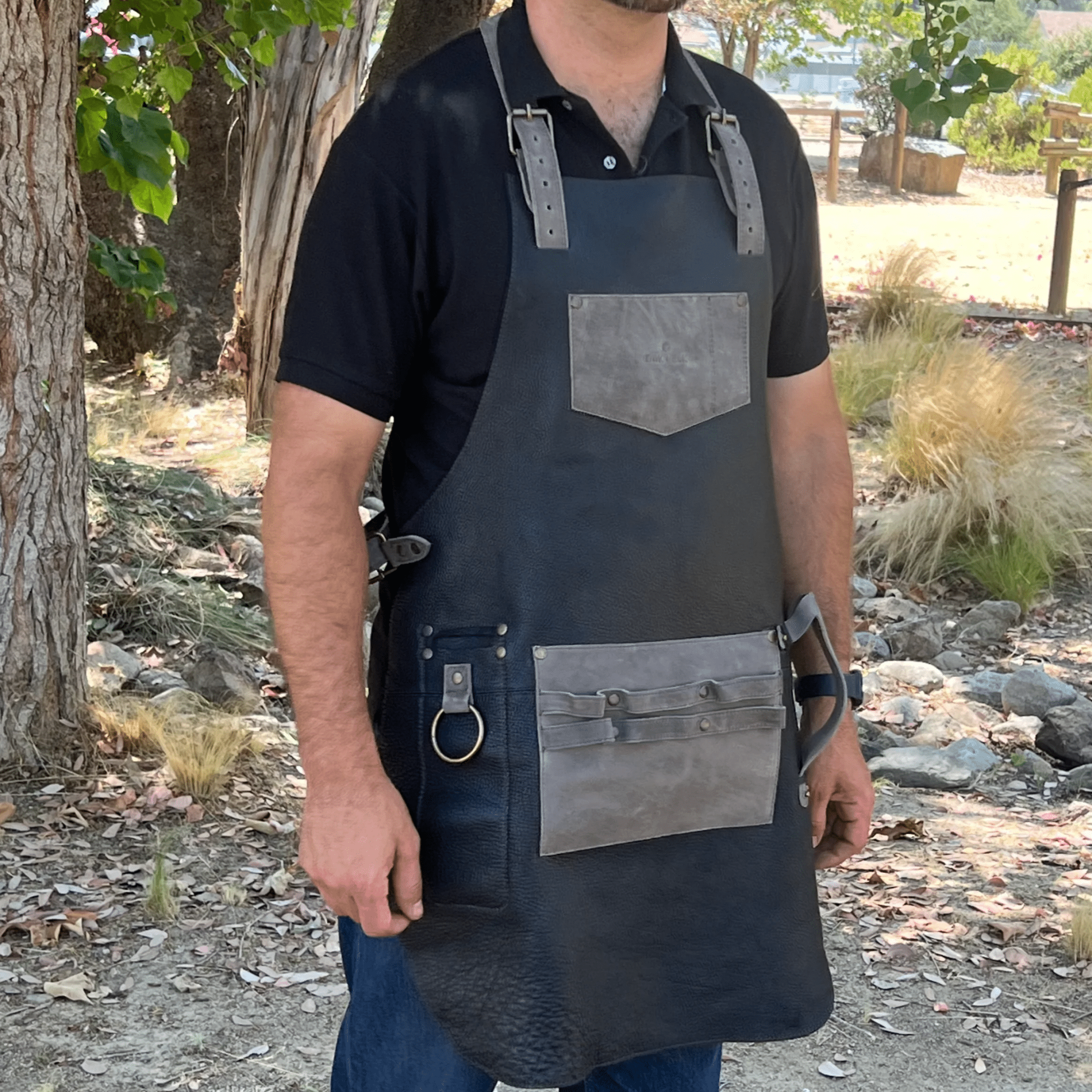 Full leather apron, adjustable straps, front chest pocket, tool loops, and rich texture, ideal for grilling, crafts, shop use